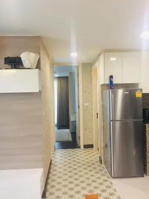 a kitchen with a stainless steel refrigerator in a room at Liv at 5 room41 in Bangkok