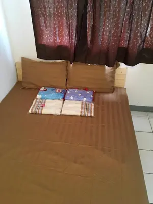 a bed with two pillows at 5บีบี 5BB guest house in Bangkok