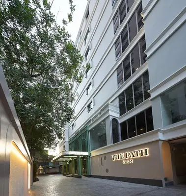 a building with a sign on the side of it at The Path Siam in Bangkok