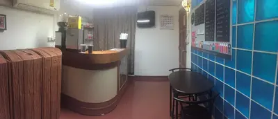 a bar in a restaurant with a counter and a stool at Room For You in Bangkok