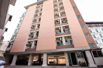 a tall building with balconies on it at Mee sook Hotel and Residence in Nonthaburi