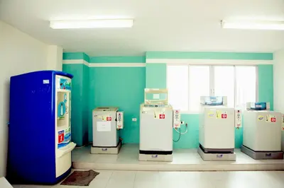 a room with several machines in a room at Mee sook Hotel and Residence in Nonthaburi