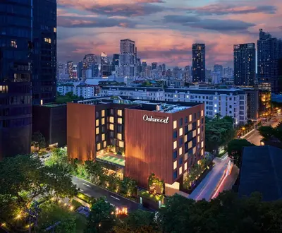 a building with the word amazon on it at night at Oakwood Studios Sukhumvit Bangkok in Bangkok