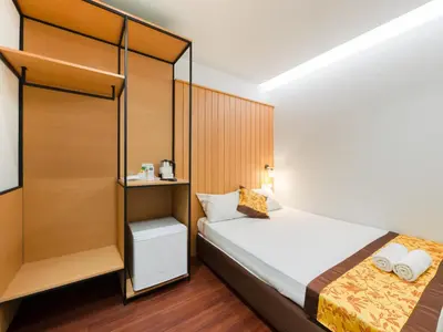 a bedroom with a bed and a bunk bed at Watergate City in Bangkok