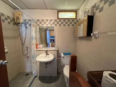 a bathroom with a sink and a toilet and a shower at The Park Land Bangna by Nudda in Bangkok