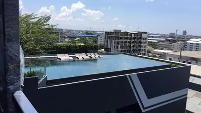 a swimming pool on the roof of a building at New condominium on Sukhumvit Road 
