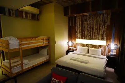 a small room with a bed and a bunk bed at Villa Bangkok in Bangkok