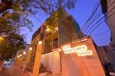 a building with a sign on the side of it at Villa Bangkok in Bangkok