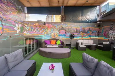 a room with a colorful mural on the wall at Hotel Icon Bangkok Sukhumvit 2 in Bangkok