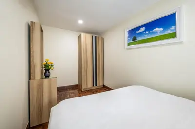 a bedroom with a white bed and a window at At FOUR-6 Bed, CITY CENTER, Nana BTS, MBK, Central World, Siam in Bangkok