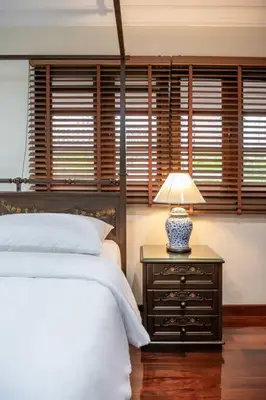 a bedroom with a bed and a lamp on a night stand at AT NANA-5Bed, CITY CENTER, Nana BTS, MBK, Central World, Siam in Bangkok