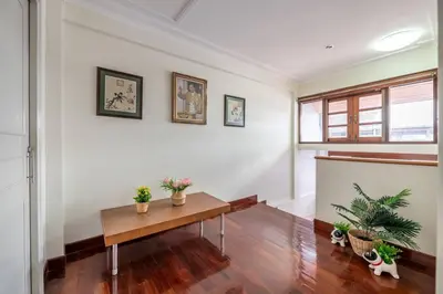 a living room with a table and potted plants at AT NANA-5Bed, CITY CENTER, Nana BTS, MBK, Central World, Siam in Bangkok