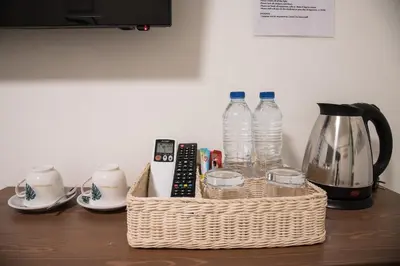 a wicker basket with two water bottles on a table at Canal View Lo-ha guest house, Contactless Check-in in Bangkok