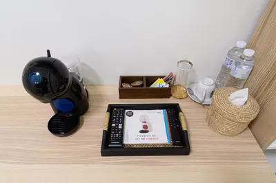 a table with a lamp and a device on it at Canal View Lo-ha guest house, Contactless Check-in in Bangkok