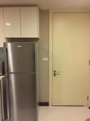 a stainless steel refrigerator in a kitchen with a door at Livat5r1042 in Makkasan