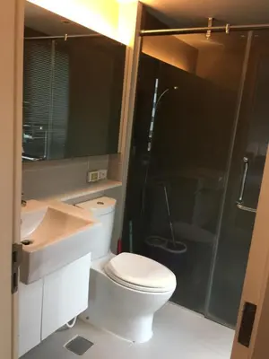 a bathroom with a toilet and a shower and a sink at Livat5r1042 in Makkasan