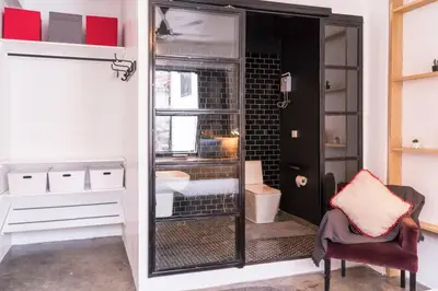 a bathroom with a shower with a toilet and a sink at Beautiful Super Modern Gigantic Designer Home in Bangkok