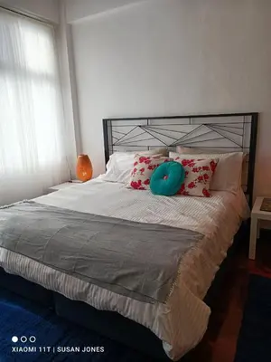 a bed with a blue frisbee on top of it at Big Groups Heaven in Central Location in Bangkok
