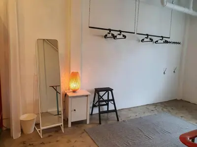 a room with a mirror and a lamp on a table at Great House for Families and Big Groups in Bangkok