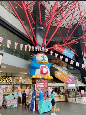 a large hello kitty sign in a store at Nato House Ekkamai -BTS Ekkamai with balcony in Bangkok