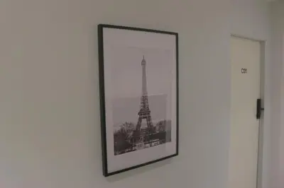 a picture of the eiffel tower on a wall at Nato House Ekkamai -BTS Ekkamai with balcony in Bangkok