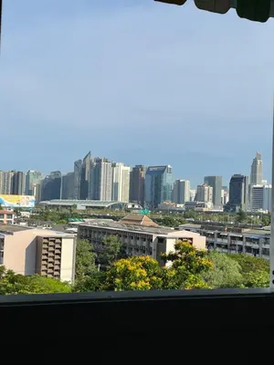 a view of a city skyline from a window at APARTMENT A4 DINDAENG in Bangkok