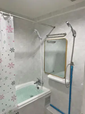 a bathroom with a sink and a mirror at APARTMENT A4 DINDAENG in Bangkok