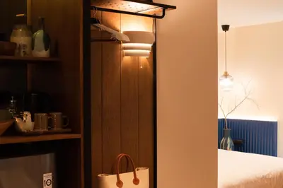 a room with a bed and a paper bag at karaarom hotel in Bangkok