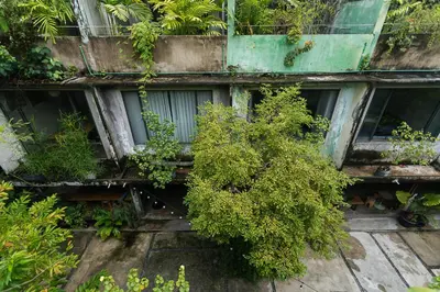 a building with plants on the side of it at GalileOasis Boutique Hotel in Bangkok