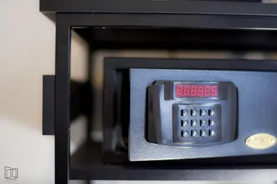 a microwave with a clock on top of it at Nana City Hotel in Bangkok