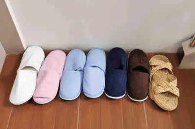 a row of different types of shoes on the floor at 8FINITE House in Bang Su