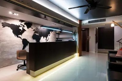 an office lobby with a world map on the wall at Kitzio House Hotel Huai Kwang in Bangkok