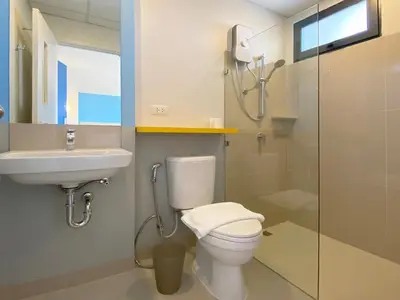 a bathroom with a toilet and a sink and a shower at HOP INN Bangkok Onnut Station in Bangkok