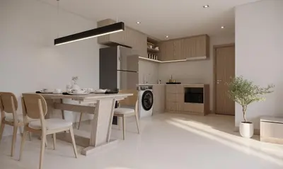 a kitchen with a table and chairs in a room at Leon Lasalle Hotel and Residences in Bangkok