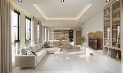 a living room with a couch and a tv at Leon Lasalle Hotel and Residences in Bangkok