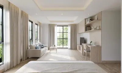 a bedroom with a bed and a couch and a desk at Leon Lasalle Hotel and Residences in Bangkok