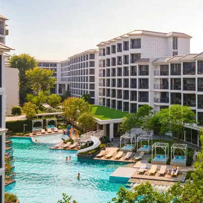 an aerial view of a pool at a resort at The Quarter Chaophraya by UHG in Bangkok