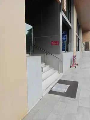 a hallway of a building with a mat on the ground at Plum central westgate@Bangyai in Ban Bang Krabu