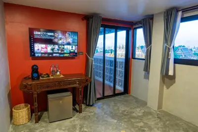 a room with a television and a table and a window at Lo-Ha Guest house, Contactless Check-in in Bangkok