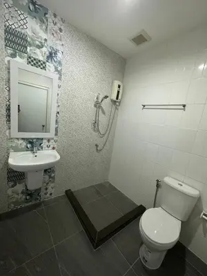 a bathroom with a toilet and a sink at S Villa @Impact Muangthongthani in Pak Kret