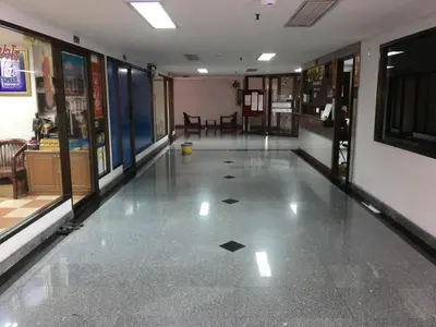 an empty hallway with a tile floor in a store at S.K. Residence in Bangkok