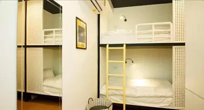 a room with two bunk beds in it at Ostay Asoke Bangkok in Makkasan