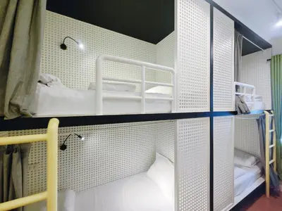 a room with a bunk bed in a room at Ostay Asoke Bangkok in Makkasan