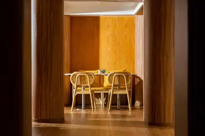 a dining room with a table and chairs at Arck Hotel in Bangkok
