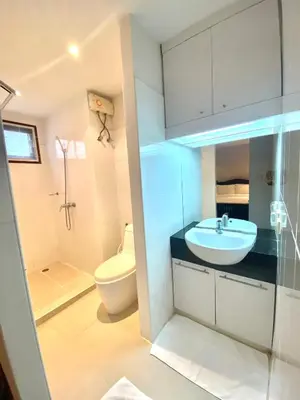a bathroom with a sink and a toilet at Cafe ice resident in Yan Nawa