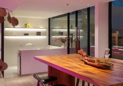 a kitchen with a counter with a wooden counter top at Jono Bangkok Asok Hotel in Bangkok