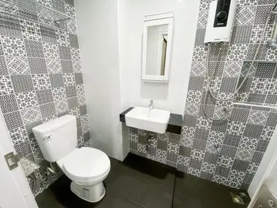 a bathroom with a toilet and a sink at GP House Bangkok - Sukhumvit Onnut BTS Skytrain in Bangkok