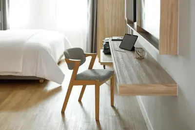 a bedroom with a desk with a laptop and a bed at Casa 17 Hotel Bangkok in Bangkok