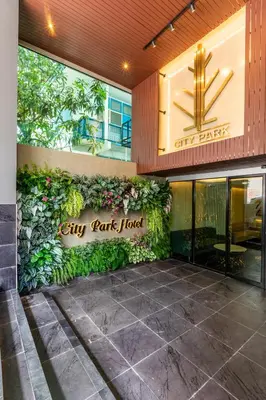 a city park hotel sign on the side of a building at City Park Hotel Bangkok Pratunam by PCL in Bangkok