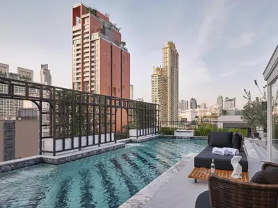 a swimming pool on the roof of a building at The Alberti Hotel - Sukhumvit 31 in Bangkok